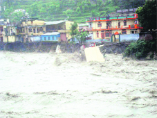 A house which collapsed in the surging waters of the Bhagirathi in Uttarkashi district on Sunday.