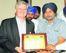 Canadian Consulate General Scot Slessor being honoured by the Punjab NRI Sabha in Jalandhar on Sunday
