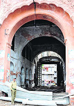 Construction material used to block the main gate of the palace at Mubarak Mandi in Jammu