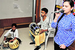 A girl participates in singing competition organised by Pooja Kala Sangam in Jammu on Sunday