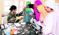 Patients being examined at the medical-cum-veterinary camp in Baramulla on Sunday
