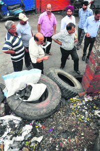 A team of the Health Department visits a tyre market in Ludhiana. 
