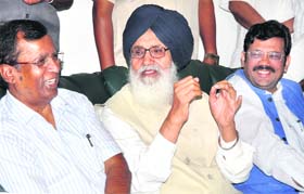 Chief Minister Parkash SIngh Badal addresses mediapersons in Phagwara on Sunday with BJP state president Kamal Sharma (right) also present