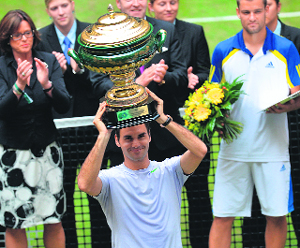 Roger Federer celebrates after winning the ATP Gerry Weber Open tournament on Sunday.