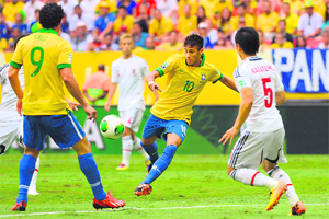 Neymar kicks the ball to score against Japan during their FIFA Confederations Cup Group A match on Saturday. 