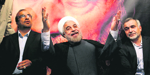 President-elect Hasan Rowhani (C) with other leaders gestures to his supporters at a rally in Tehran.