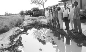 Trucks stopped by villagers in protest against the damage caused to a road due to the work on an airport at Jheurheri village in Mohali on Monday. 