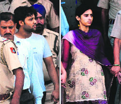 Accused Basant and his accomplice Sarita in police custody in Chandigarh on Monday. 