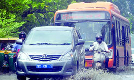 A road near the Lajpath Nagar Metro station after the rains in New Delhi on Monday.