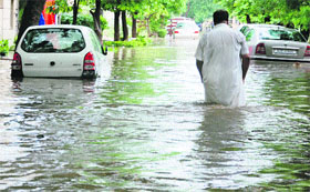 A waterlogged street after a downpour in Gurgaon on Sunday. 