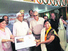 Shamim Sharma receives Sahitya Akademi award from Governor Jagannath Pahadia and Chief Minister Bhupinder Singh Hooda. 