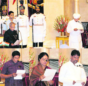 President Pranab Mukherjee administers oath to newly inducted ministers Sisram Ola and (L to R in the bottom row) Oscar Fernandes, Girija Vyas and KS Rao at a ceremony at the Rashtrapati Bhavan in New Delhi on Monday.  PTI