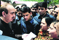 Union Health Minister Ghulam Nabi Azad talks to devotees at Kheer Bhawani temple near Srinagar on Monday. 