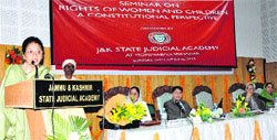 First Lady Usha Vohra speaks during a seminar at the state Judicial Academy Complex at Mominabad in Srinagar on Sunday.