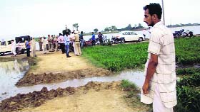 Water being diverted from a field at Ber Kalan village in Payal