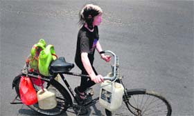 A girl on her way to fetch water on a warm Monday afternoon in Ludhiana