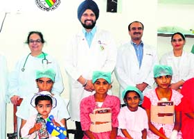 Dr Harinder Singh Bedi (second from left), who performed the surgery on the girl