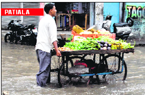 A vendor in a flooded street in Patiala