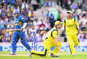 Shane Watson (centre), Mathew Wade celebrate the fall of Tillakaratne Dilshans wicket during the Champions Trophy match at The Oval, London
