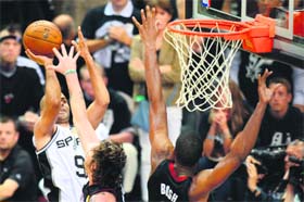 Tony Parker shoots under pressure against Miami Heat during game 5 of the NBA finals on Sunday