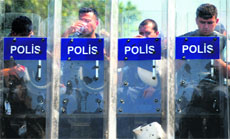 The police guards the entrance of the Gezi Park at the Taksim Square in Istanbul on Monday.