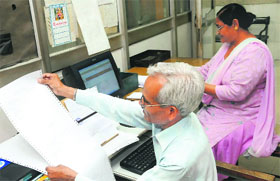 Telegraphists Munshi Ram and Saroj Bala Sharma at work in the BSNLs Bathinda office on Tuesday. Tribune photo: Pawan Sharma