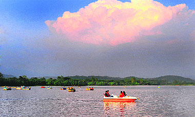 With the weather turning pleasant after the recent rainfall, tourists enjoy boating at the Sukhna Lake on Tuesday. 