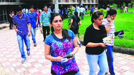 Students come out from a centre after appearing in the CET at Panjab University in Chandigarh on Tuesday.