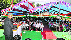 Chief Minister Virbhadra Singh addresses a public meeting at Nagwani in Mandi on Tuesday