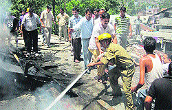 Villagers and Fire Brigade crew douse flames in Chamba on Tuesday