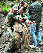 Armymen rescue a pilgrim in Chamoli district on Tuesday