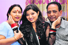 Actress Neha Lahotra with her parents in Jammu.