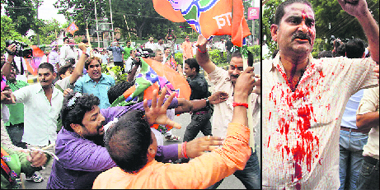 Supporters of JD(U) and BJP slug it out; (right) an injured JD(U) worker in Patna on Tuesday.