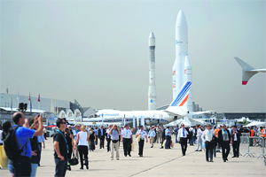 Visitors at the 50th International Paris Air show at the Le Bourget airport on Tuesday