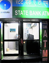 An ATM of the State Bank of Patiala stands unguarded in Bathinda