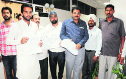 Members of the Zila Parishad come out after submitting a memorandum to the MC Commissioner at the Municipal Corporation office, Sector 17, Chandigarh, on Wednesday. Tribune photo: Parvesh Chauhan