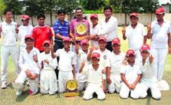 Team members of the St Soldier Cricket Academy flash the victory sign after winning the cricket cup in Panchkula on Wednesday. a tribune photograph
