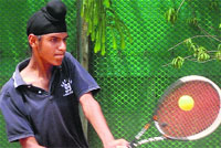 Sohrab Singh returns a shot during a match at the Swami Ram Tirath Total Tennis Championship at Phase IV in Mohali on Wednesday. a Tribune photograph