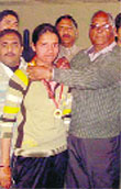 A file photo of the victim, Megha, while receiving a gold medal in boxing.