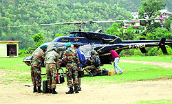 A private helicopter gets ready to fly rescued pilgrims from Rudraprayag district at Augustmuni in Garhwal