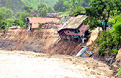 Houses damaged at Balvakot by a river in Pithoragarh district