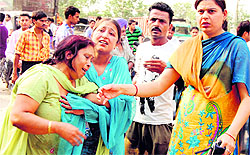 Inconsolable family members of the motorcyclist who was killed in a road accident at Lamba Chowk village in Jalandhar on Wednesday