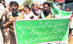 PDP workers protest against Education Minister Mohammed Akbar Lone in Srinagar on Wednesday. Tribune photo: Amin War