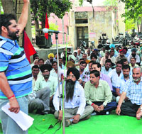 Employees of Punjab State Power Corporation Limited hold a protest in Ludhiana on Wednesday. 