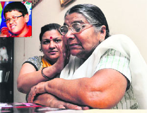 The grandmother of Servesh (inset), Sudershna Salwan, breaks down in Ludhiana on Wednesday.