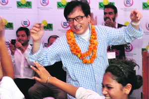 Actor Jackie Chan with children in New Delhi on Wednesday. 