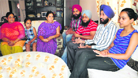Family members narrate their tale of woe after returning safely from Hemkund Sahib, at their residence in Sector 40, Chandigarh, on Thursday.