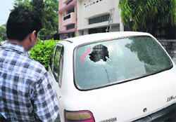 An unidentified person broke the glass of the car in the wee hours in Sector 43, Chandigarh, on Thursday. 