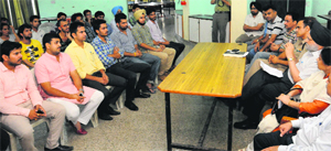 The Panjab University authorities and DSP (Central) Ashish Kapoor hold a meeting with student leaders in Chandigarh on Thursday. 