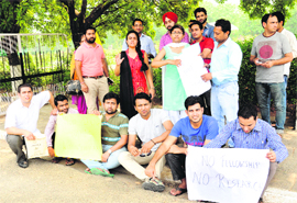 Research scholars of Panjab University protest in front of the Vice-Chancellors office on Thursday. 